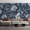 Floral pattern with white flowers and leaves on a blue background||