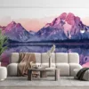 Serene mountain landscape at sunset with pink and purple hues reflected in water.||