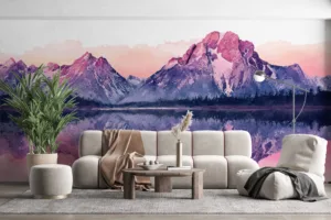 Serene mountain landscape at sunset with pink and purple hues reflected in water.||