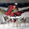 Spider-Man hanging upside down in vibrant street art.