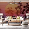 Layered design of floral silhouettes against a gradient sunset background