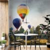 Hot air balloons in a serene landscape with a pastel sky