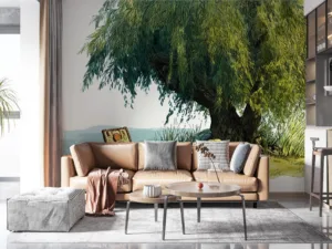 A serene picnic scene under a willow tree with an open basket and a blanket.||
