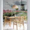 Country landscape with windmill and tulips
