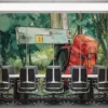 Red backpack resting against a wooden signpost in a green outdoor setting||