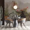 Vintage bicycle leaning against a textured wall with flowering plants||